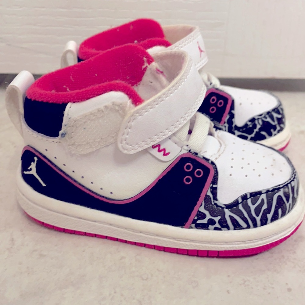 Baby girl size 4 Air Jordon high top sneakers.